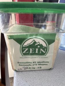 A picture of 4 lbs durum wheat in a Cambro container.
